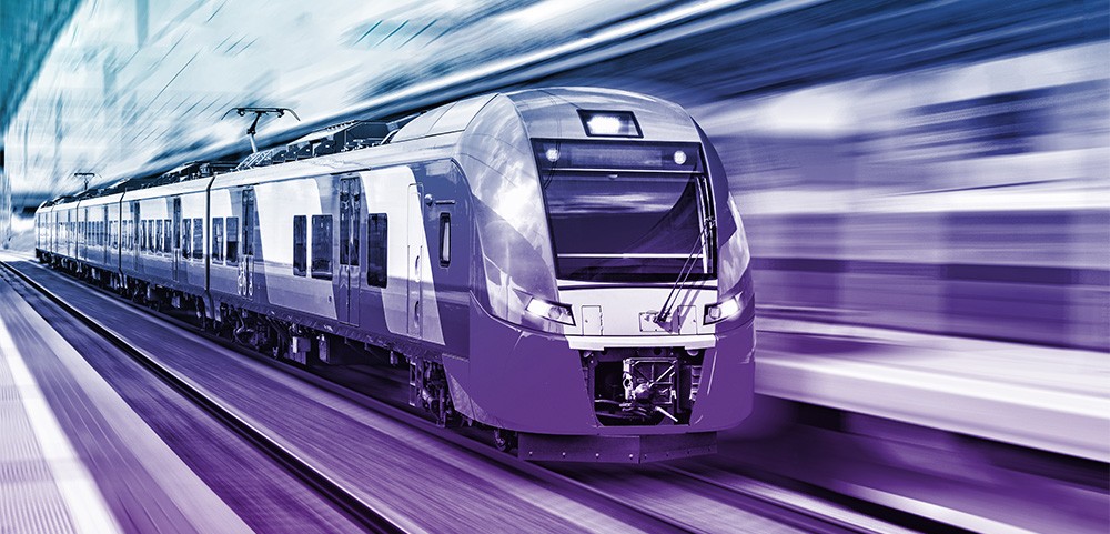 A photo of a bullet train taken from the front with a blue-purple gradient filter over top. This represents Wolfspeed products that support e-mobility projects using railways