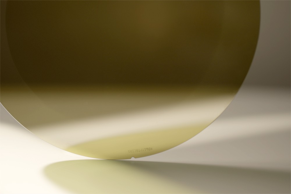 Promotional image of a 200mm Wolfspeed wafer