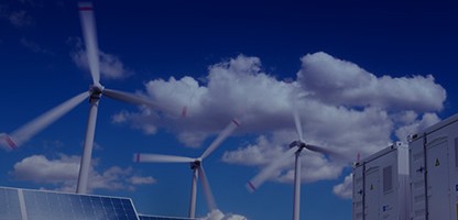 Solar panels and wind turbines in a field generating renewable energy, representing Wolfspeed's commitment to clean energy.
