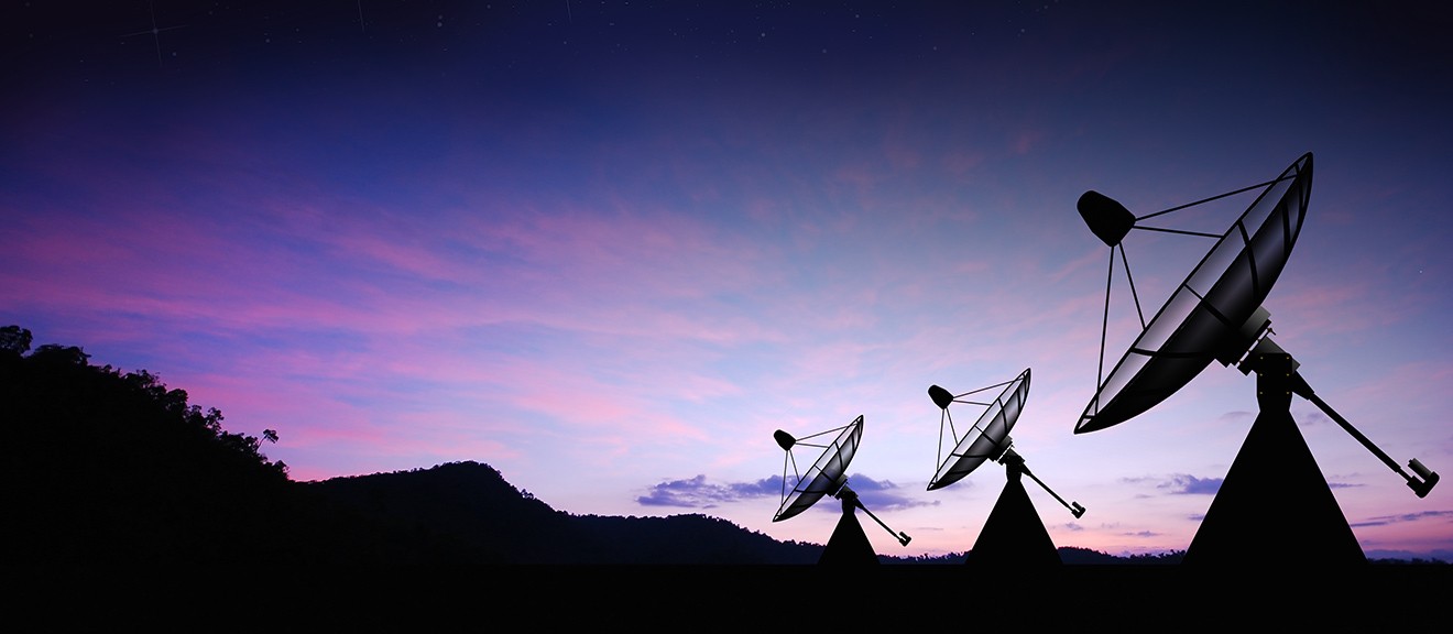 Three satellites during sunset representing Wolfspeed's work in the Aerospace sector.