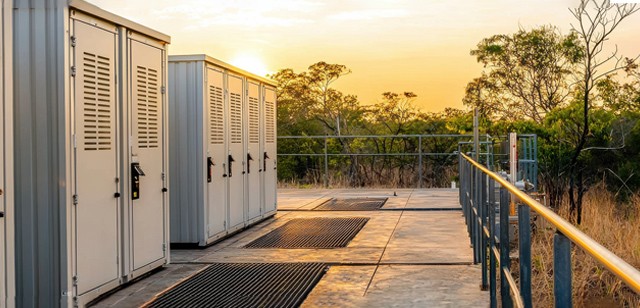 Image of solid state transformers with the sun going down in the background.