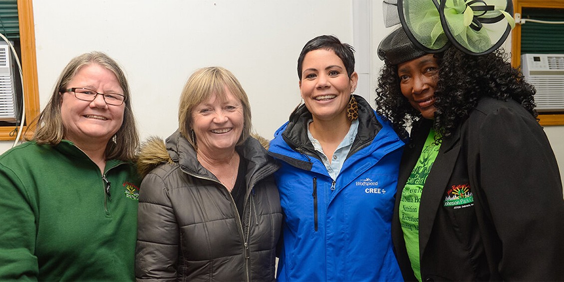 A group shot of four women side by side after delivering goods to the Utica Rescue Mission.