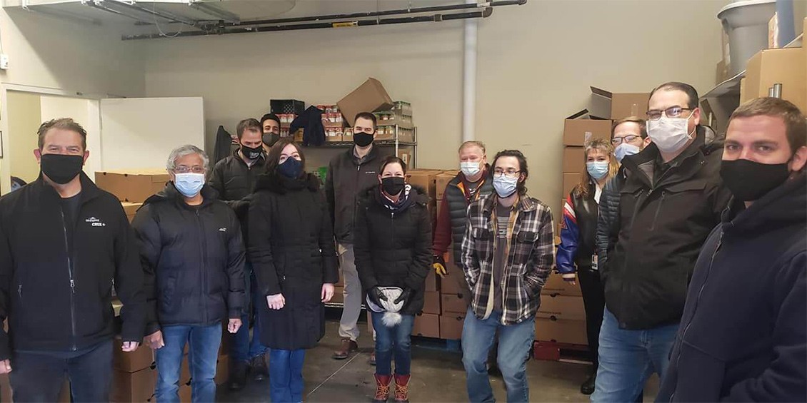 The Wolfspeed Mohawk Valley Team pauses for a quick photo after delivering 200 turkeys to the Rescue Mission of Utica.
