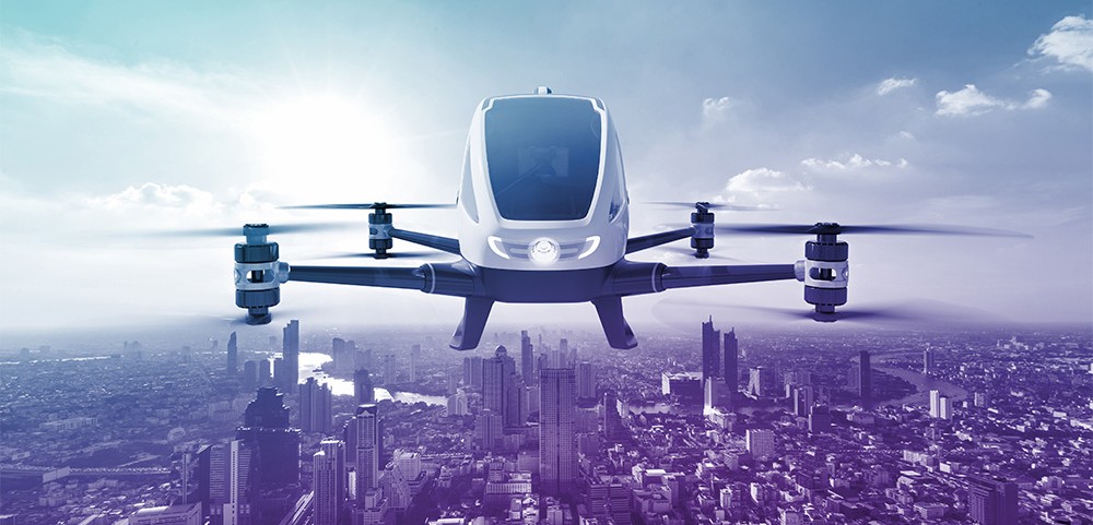 An forward-facing image of a helicopter with a blue-purple gradient filter over top. This represents Wolfspeed's products that support e-mobility projects in the sky.