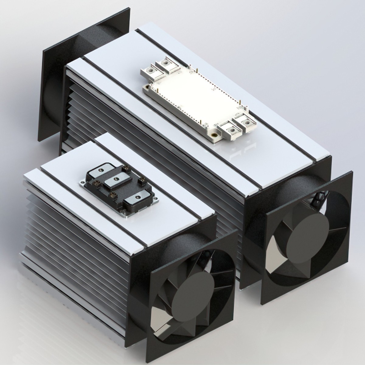 Photograph showing how Wolfspeed's XM3 power module requires a smaller heatsink and only one fan, compared to a EconoDUAL® module.